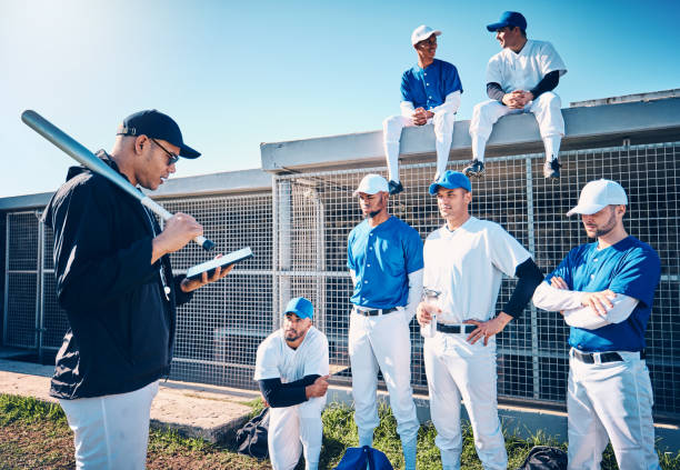Baseball coach reviewing paperwork