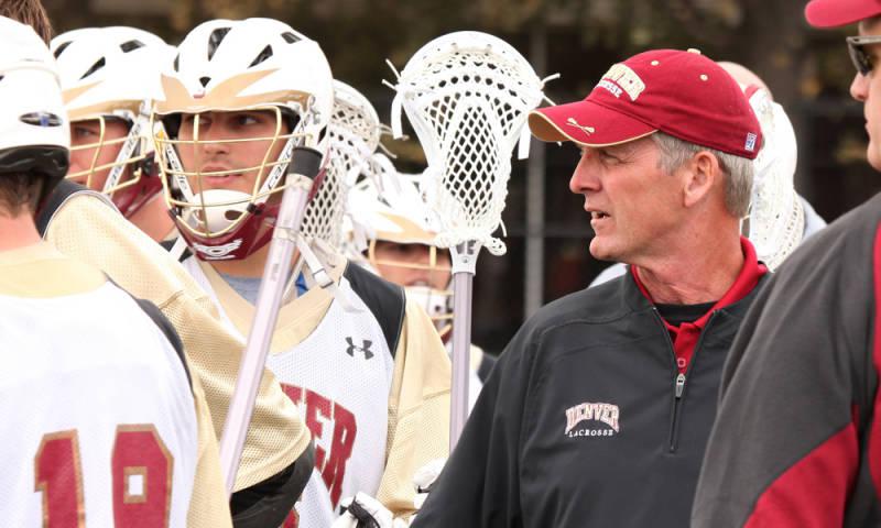 Lacrosse coach reviewing paperwork